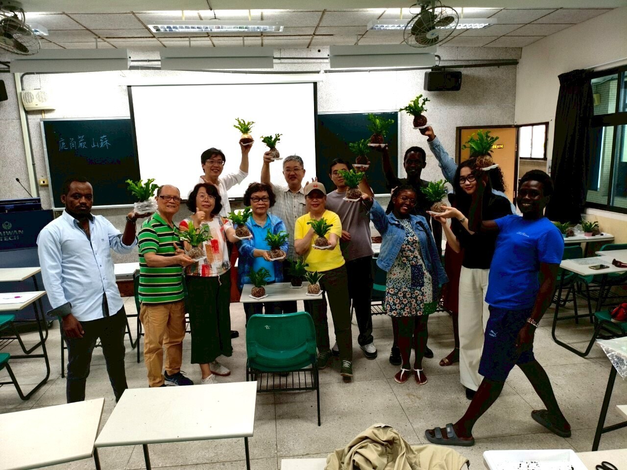 Senior and international students worked together to create staghorn fern and mountain moss balls.