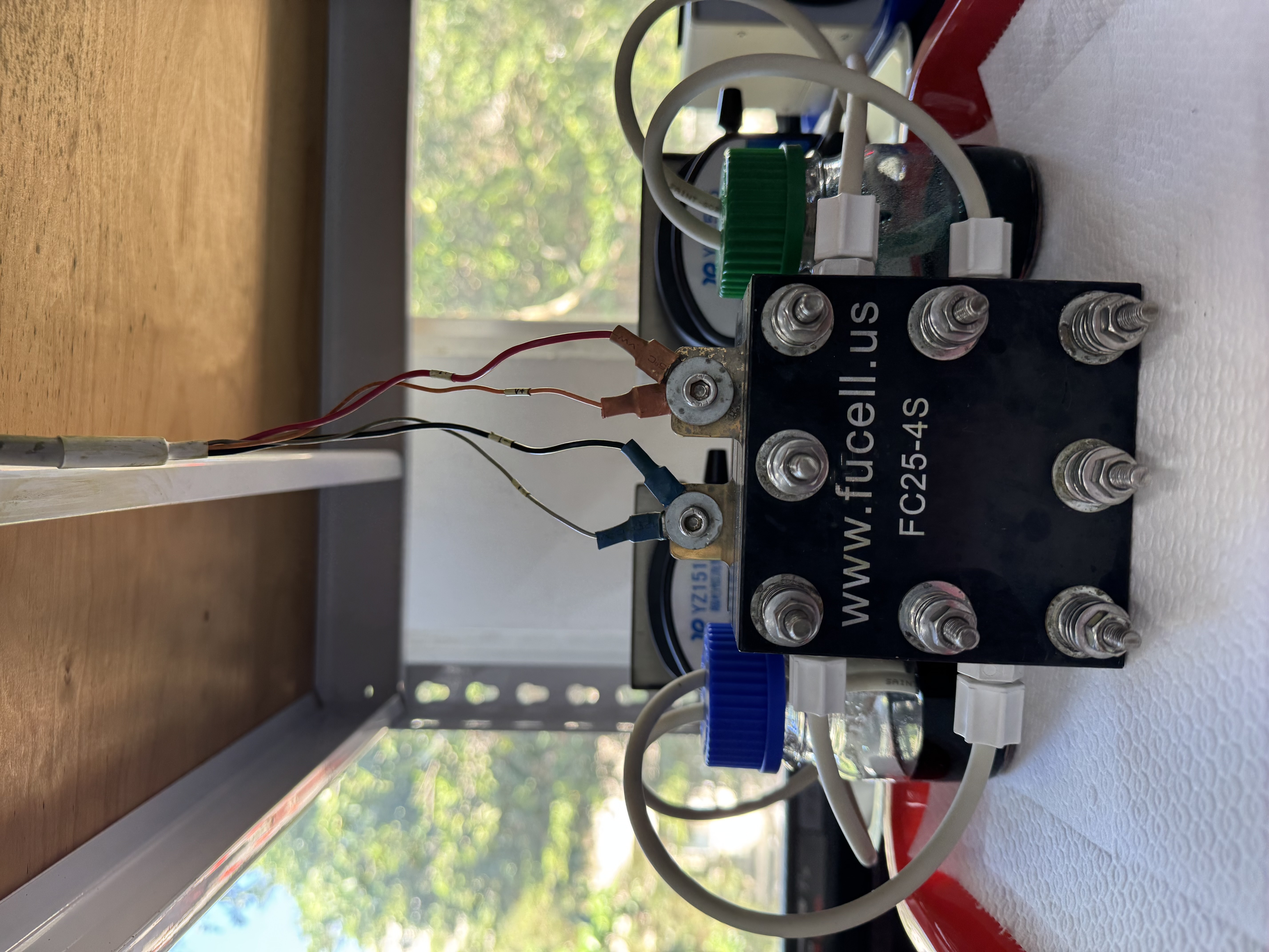 Professor Yu-Lin Kuo leads a team that has developed a vanadium redox flow battery using plasma technology. Shown here is a single-cell vanadium redox flow battery used to test the effects of electrode materials on electrochemical performance.