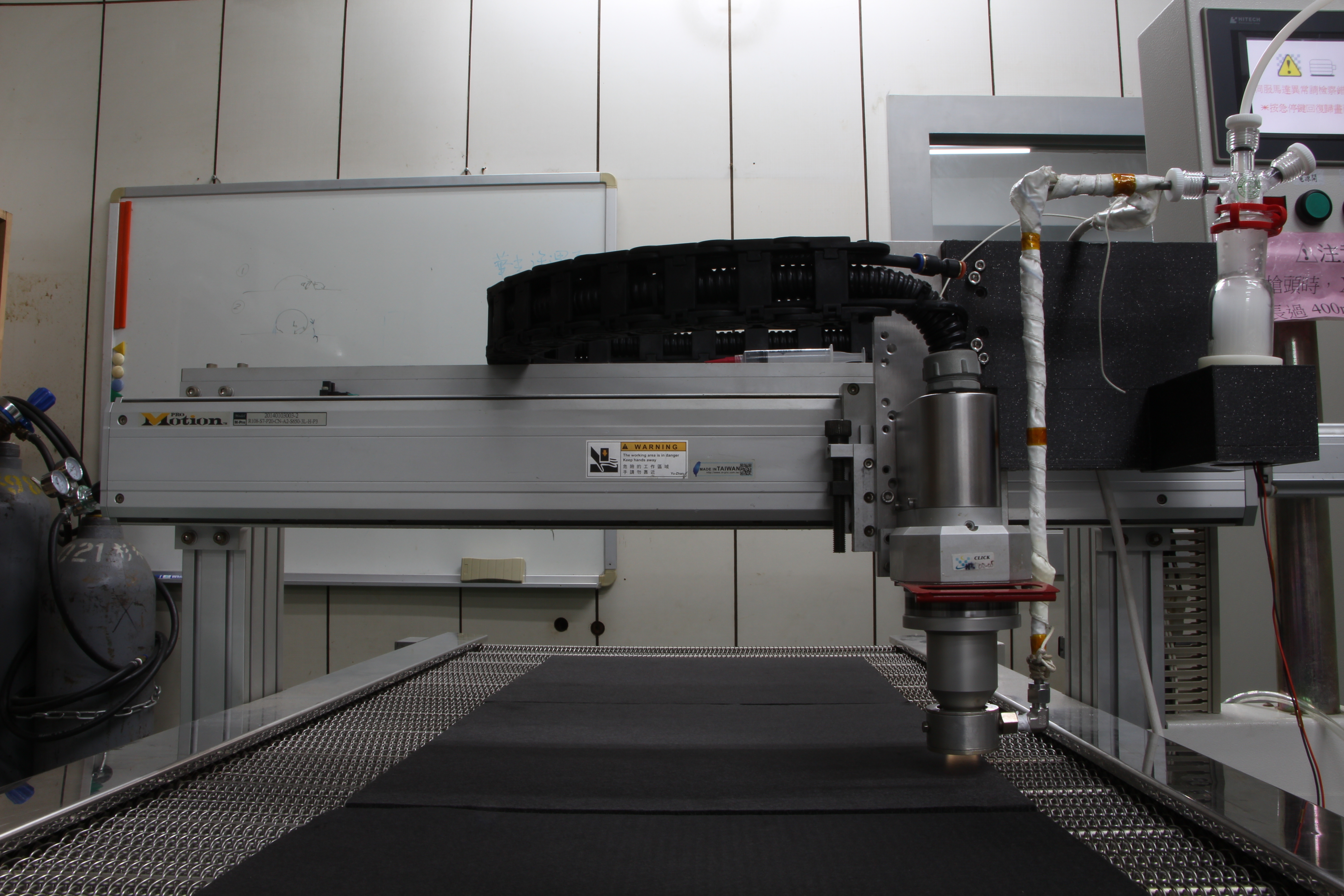 The team used room-temperature, atmospheric-pressure plasma technology to uniformly deposit various metal oxides as catalysts for energy storage reactions onto carbon materials. Shown here is the large-scale jet-type atmospheric-pressure plasma coating equipment.