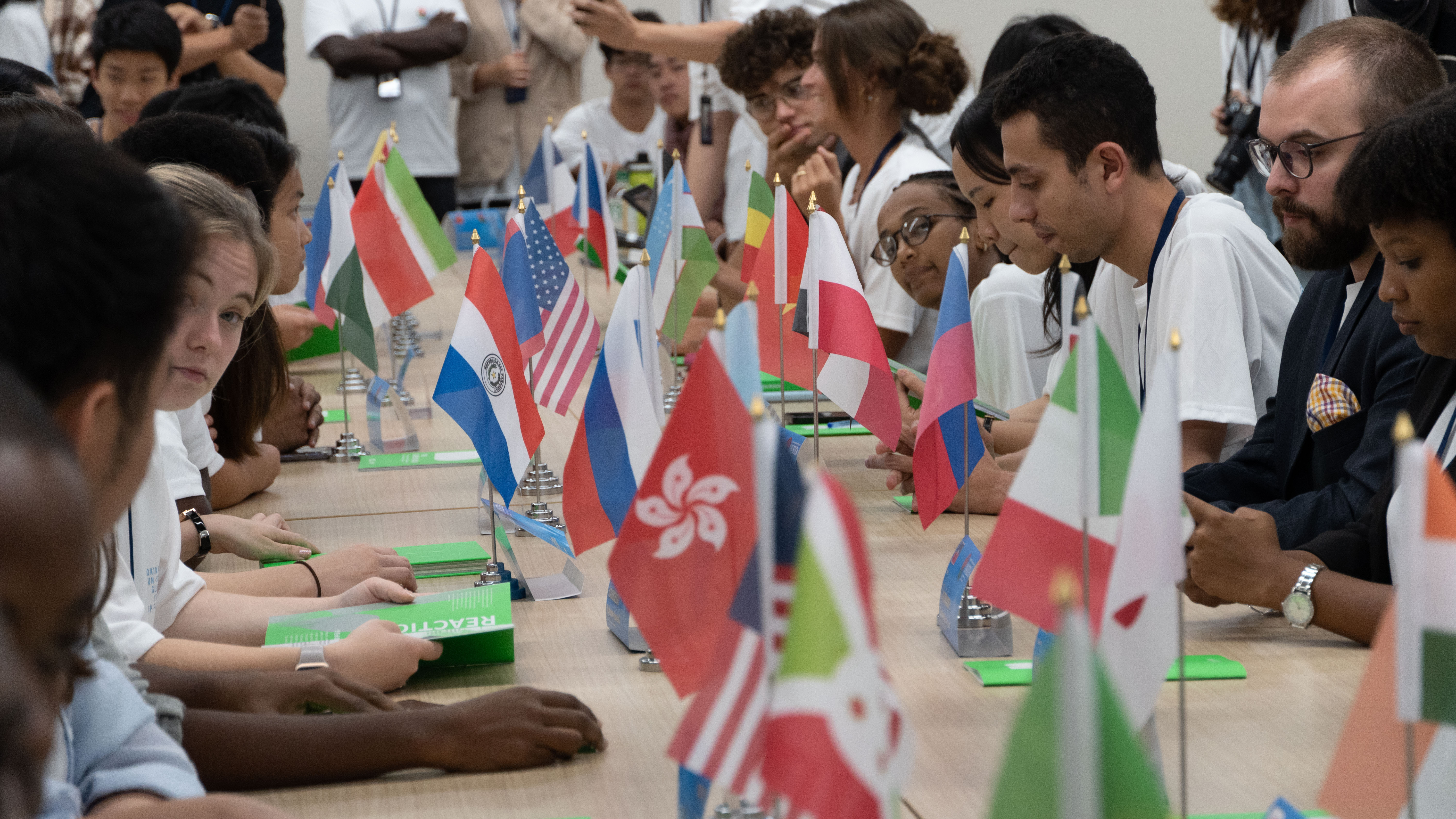 Nearly 100 youth ambassadors from 30 countries gathered to simulate a United Nations summit, collaboratively exploring global sustainable development goals.