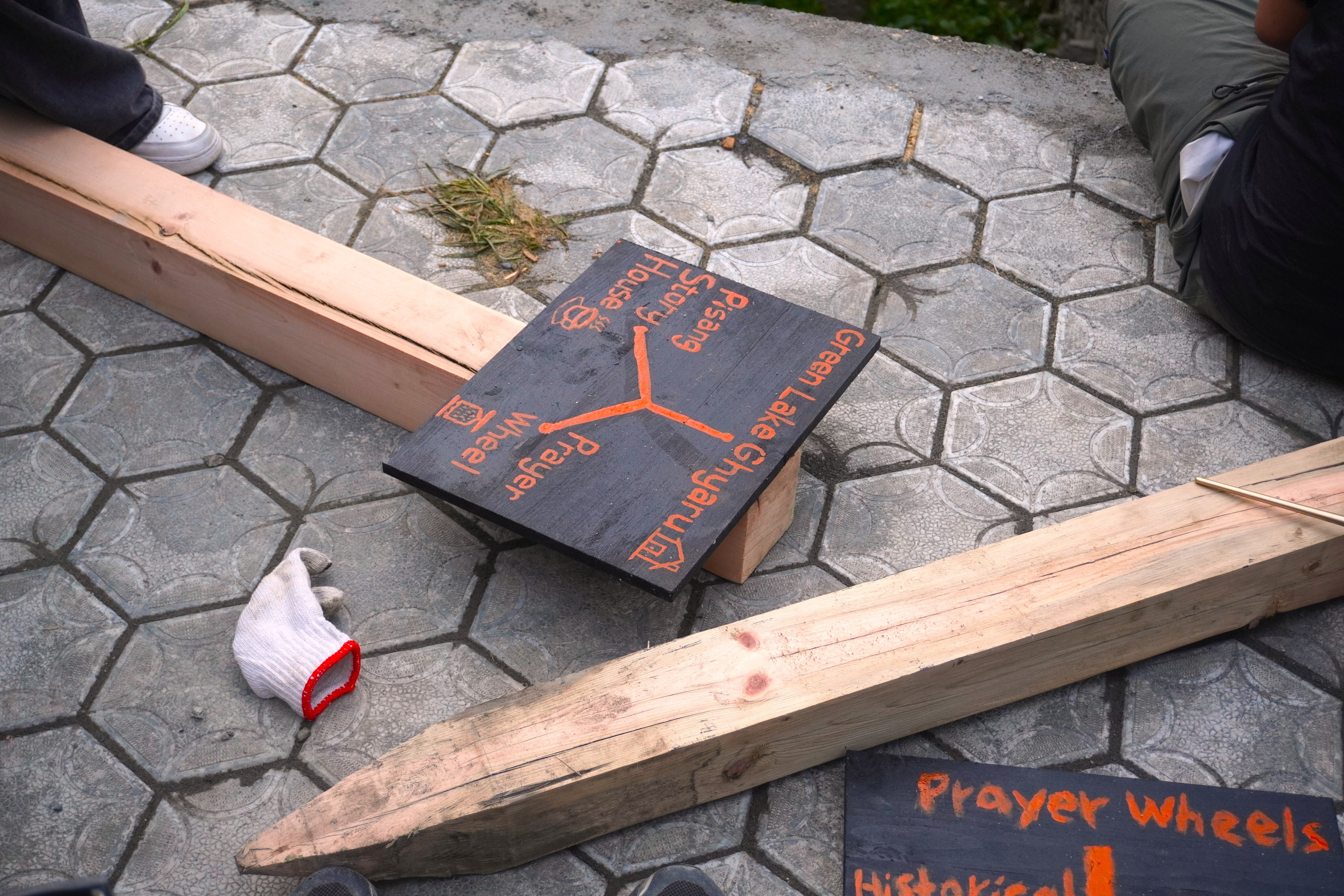 Student team members hand-paint road signs.