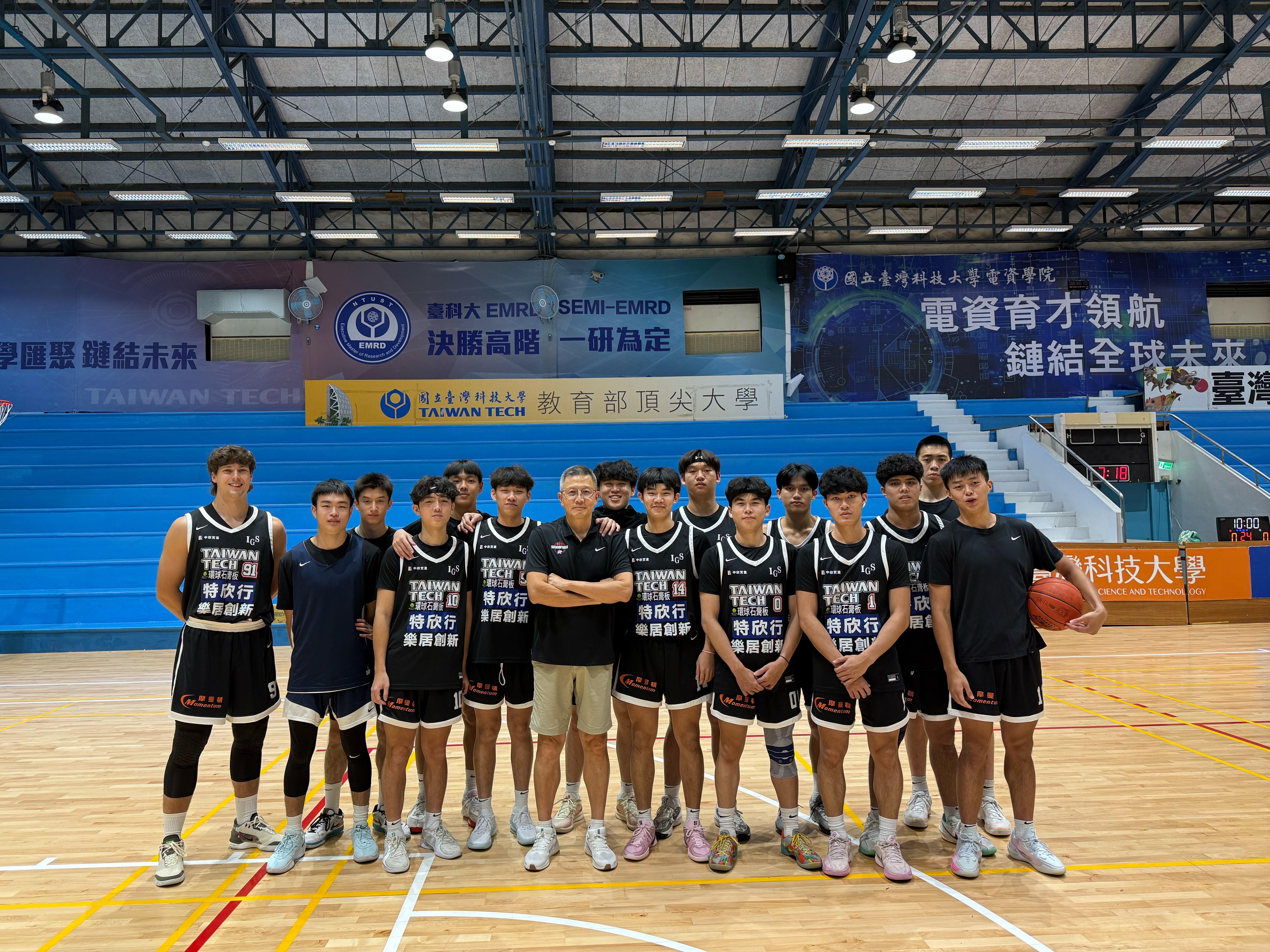 Team photo of the Men's Open Division at the 114th National Intercollegiate Basketball League.