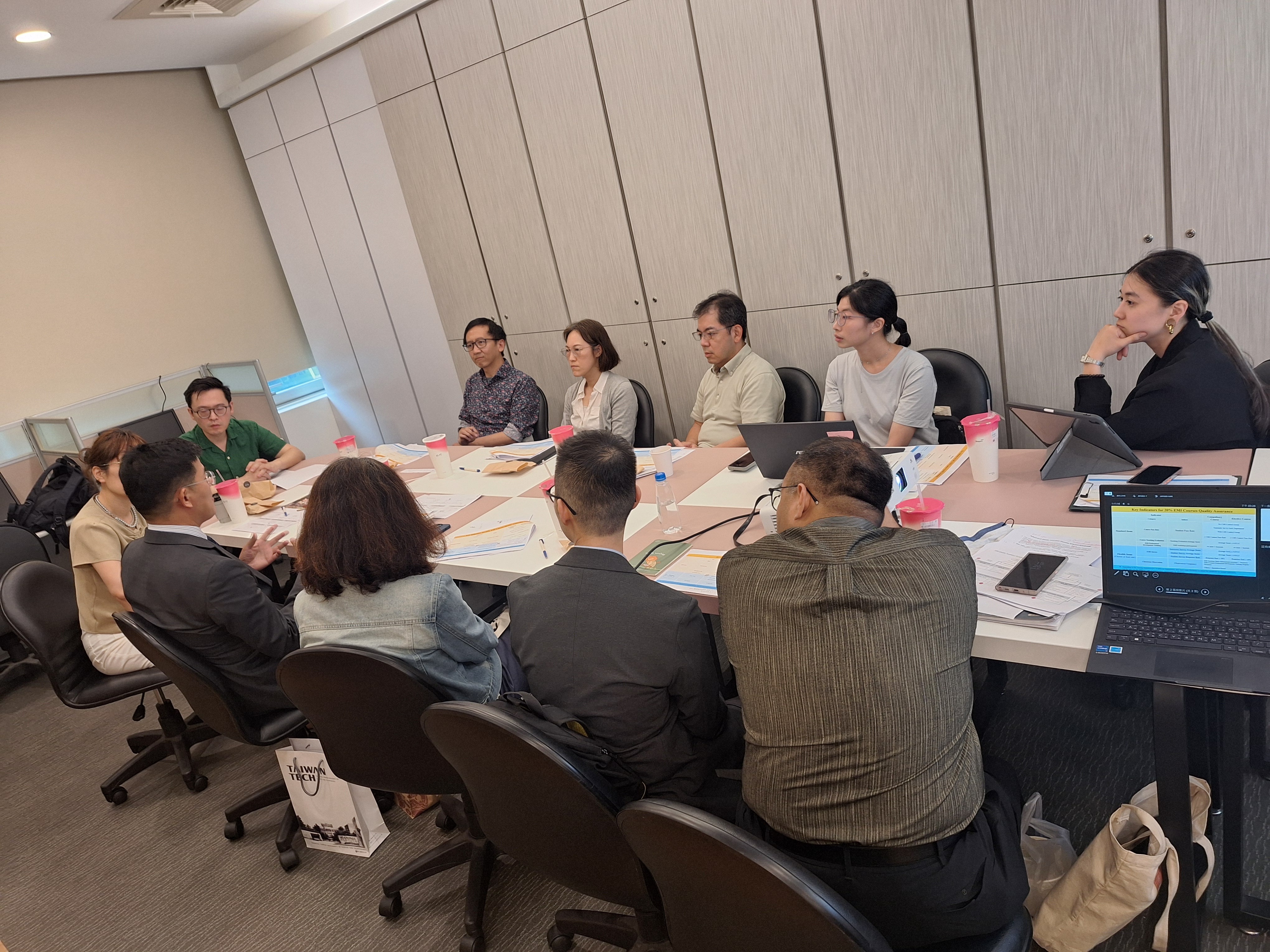 Prof. Kongji Qin (front row, second from left) shared how New York University has institutionalized faculty onboarding and management practices to ensure teaching quality.