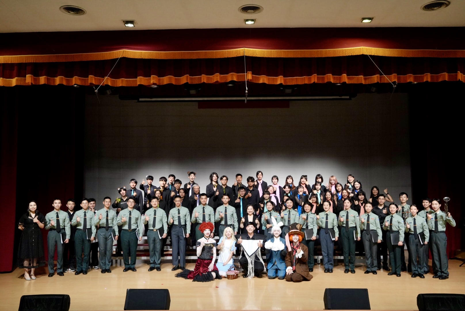 Group photo of Taiwan Tech and National Defense University collaborators behind the themed concert “Alice’s Fantastic Journey.”