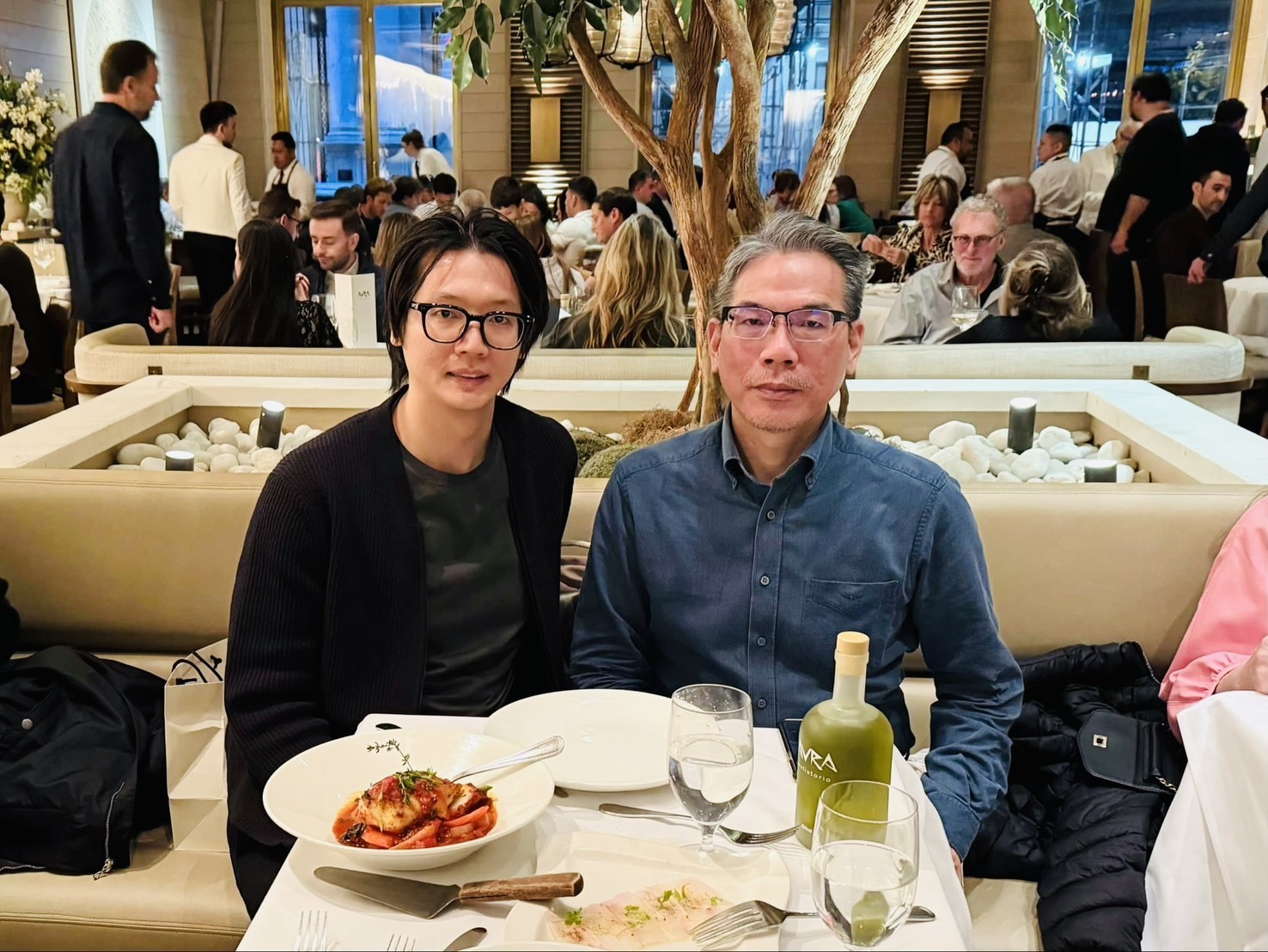 Ken-Tsai Lee (right) poses for a photo with a graduate student who has been in New York for ten years.
